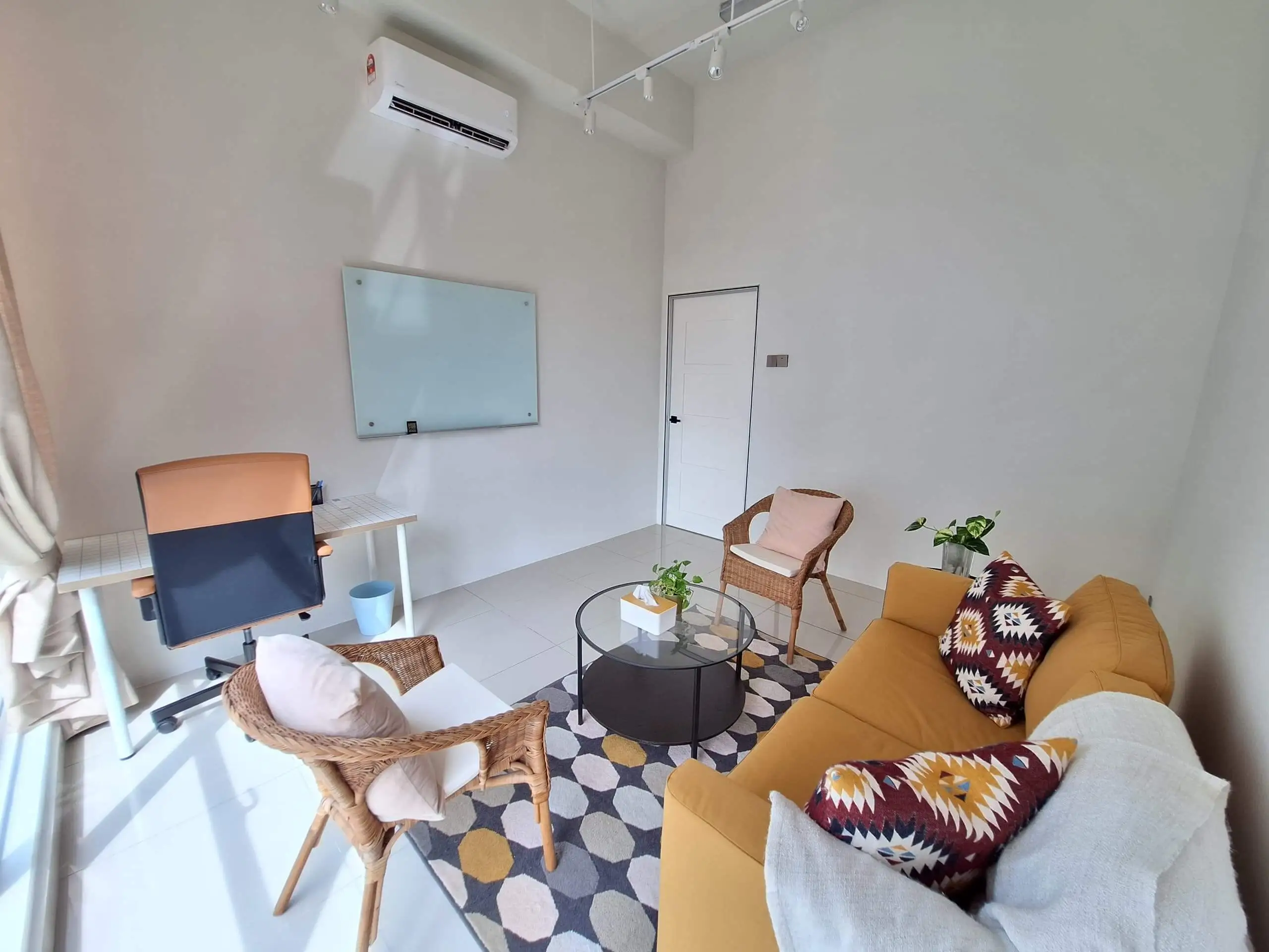 Therapy Room Entry & Interior Private counselling room with seating and secure entry