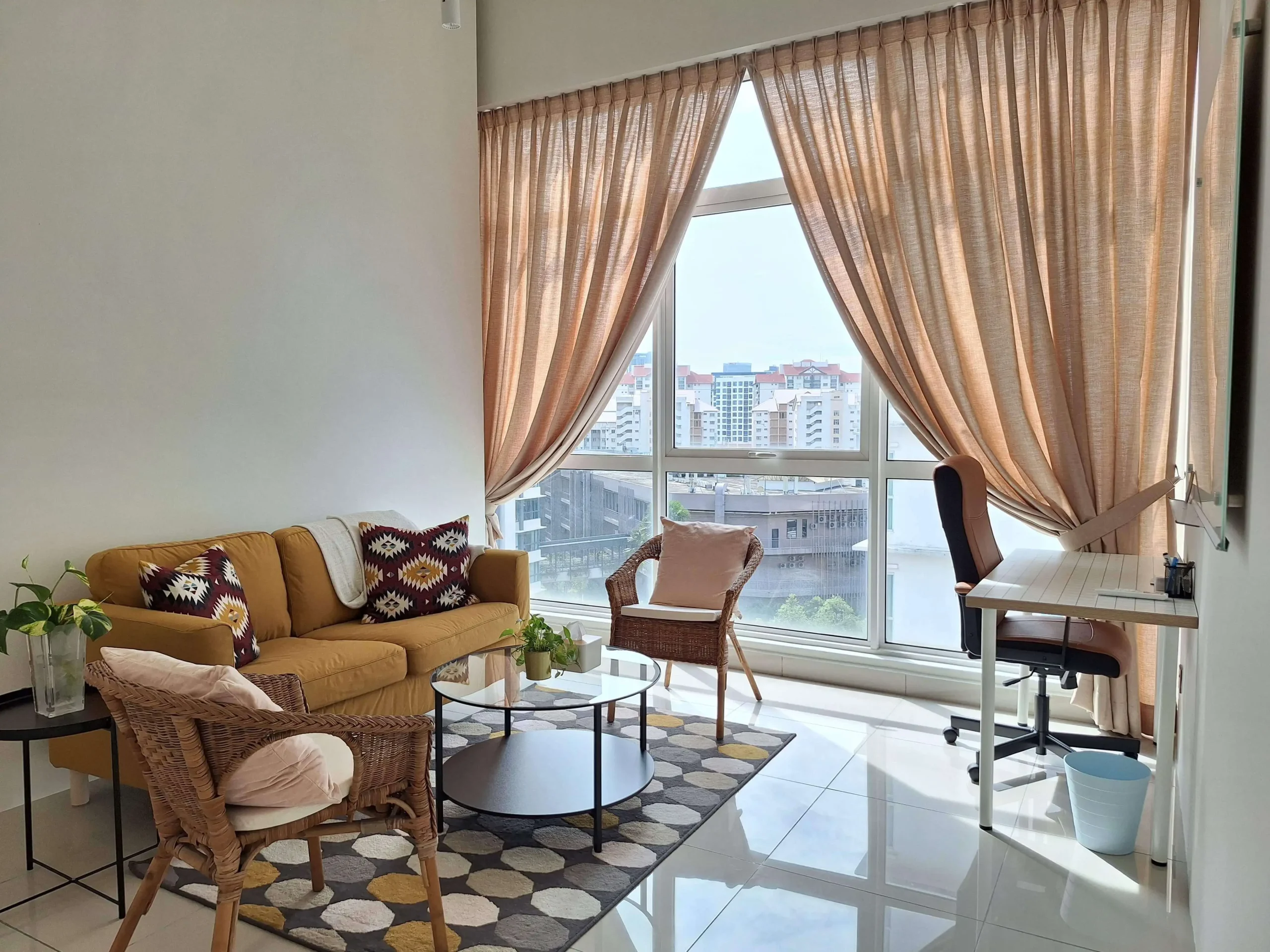 Therapy Room with Couch and Natural Light Comfortable therapy room with client seating and scenic window view